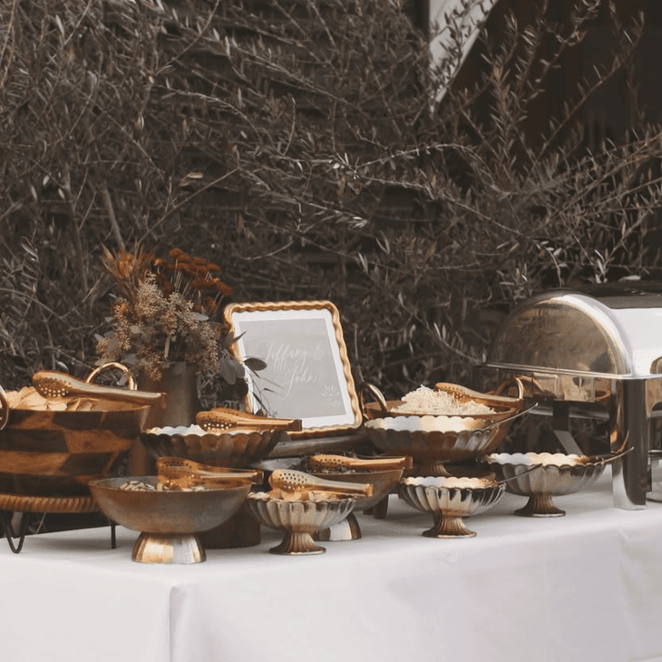 Madres buffet spread on brass serving ware